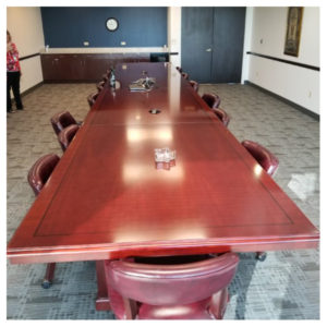 A used conference table in an office